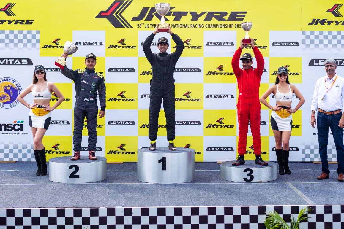 Avi celebrating on a championship podium